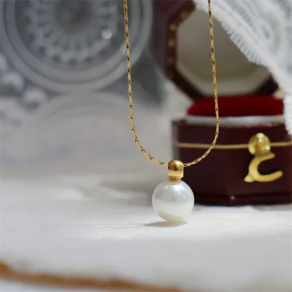 Bijoux-En-Gros-l-gant-Style-Simple-Rond-Acier-Au-Titane-Perles-Artificielles-Incruster-Pendentif (3) Pendentif Élégant